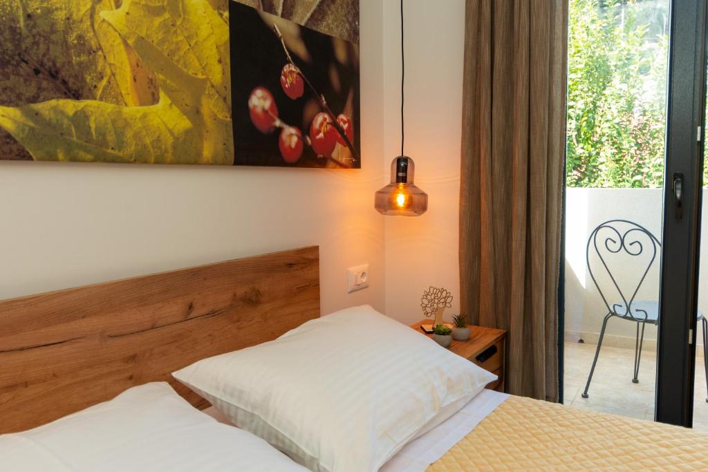 Postel nebo postele na pokoji v ubytování Golden Seashell Apartment