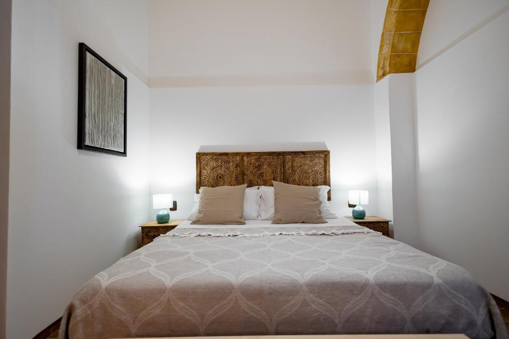 Letto o letti in una camera di Sciaraqa