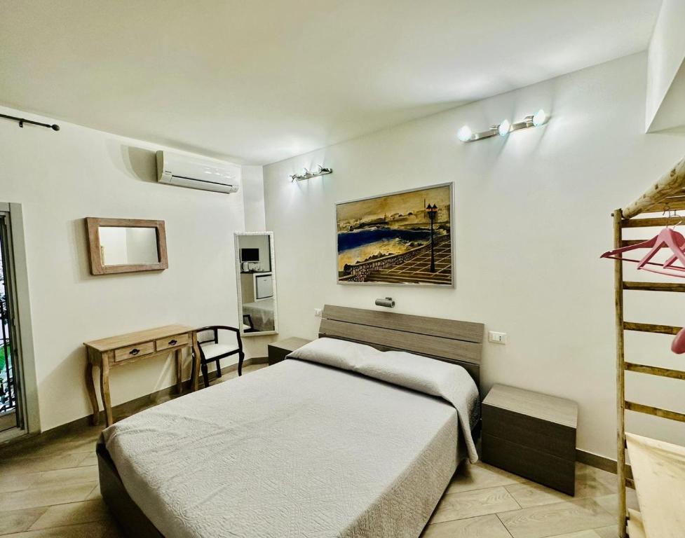 a bedroom with two beds and a ladder at San Lorenzo Room in Trapani