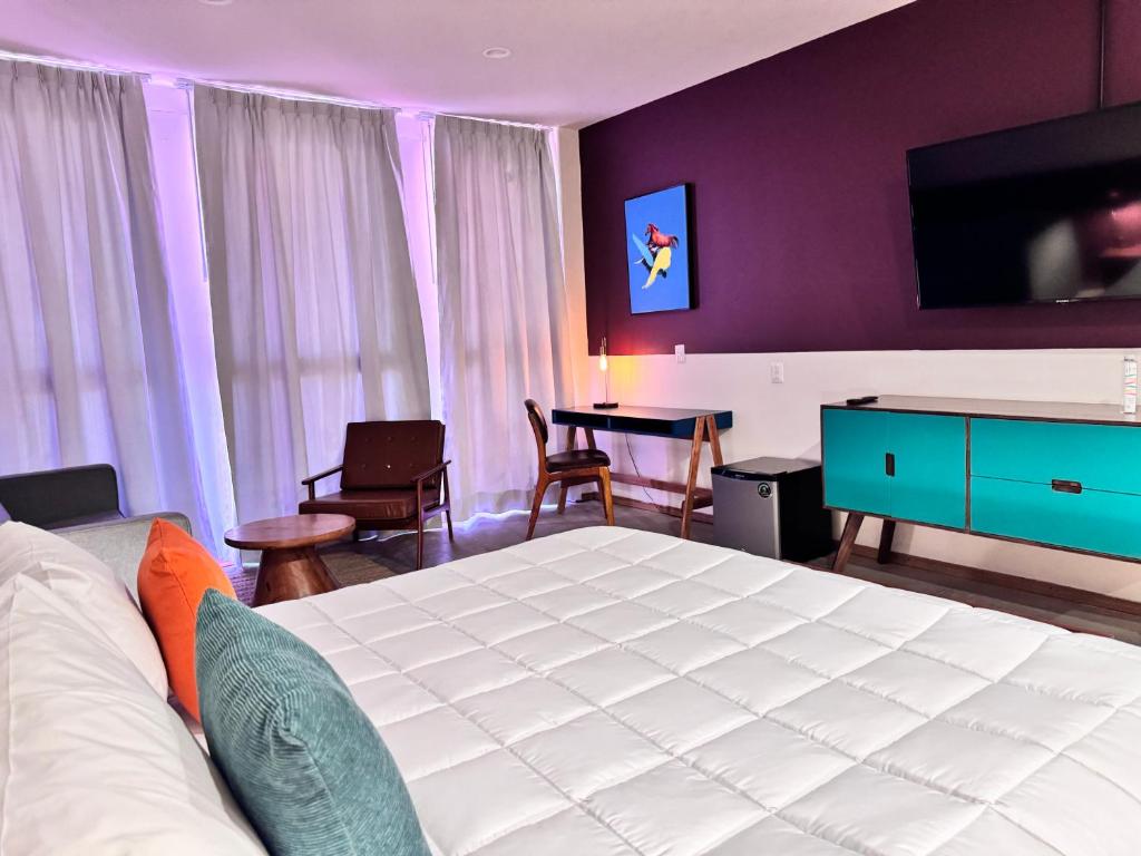 Postel nebo postele na pokoji v ubytování Hotel Olá Chapultepec