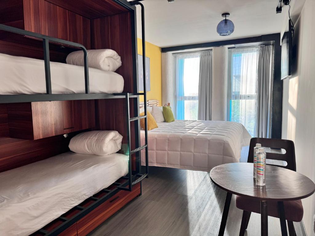Postel nebo postele na pokoji v ubytování Hotel Olá Chapultepec