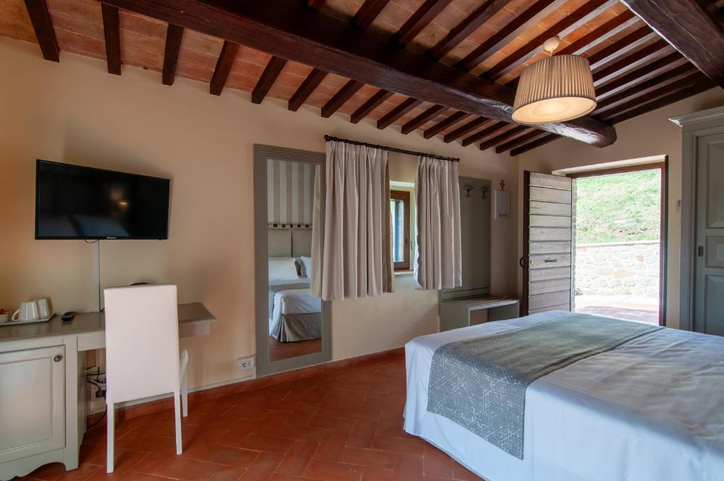 Postel nebo postele na pokoji v ubytování Borgo Sant'Apollinare - Resort