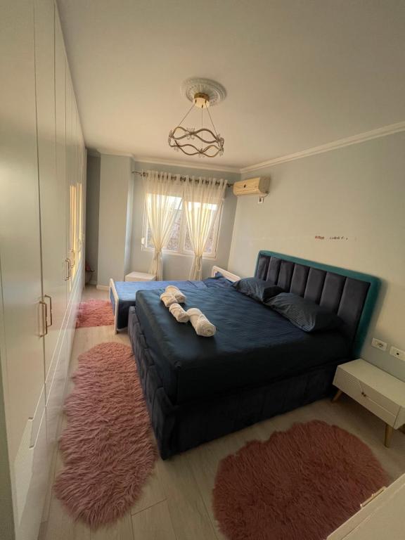 Ένα ή περισσότερα κρεβάτια σε δωμάτιο στο Besa Apartment