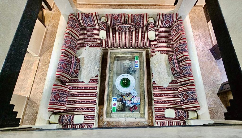 a bathroom with a washing machine in a mirror at Riad Dar Haven in Tamraght Ou Fella
