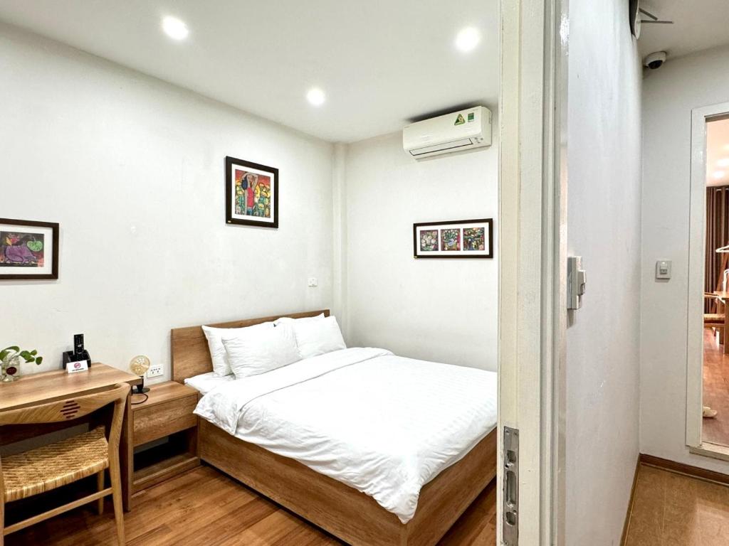Postel nebo postele na pokoji v ubytování Picturesque Hanoi Homestay