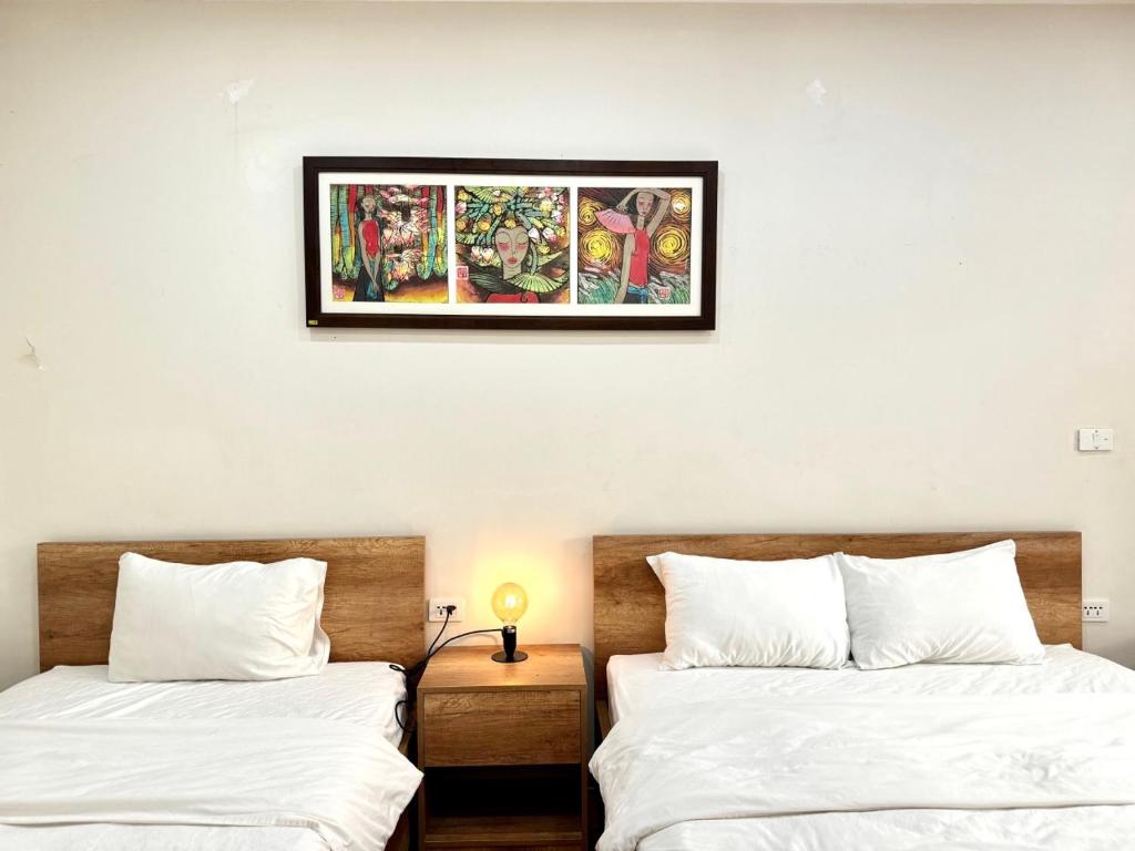 Postel nebo postele na pokoji v ubytování Picturesque Hanoi Homestay