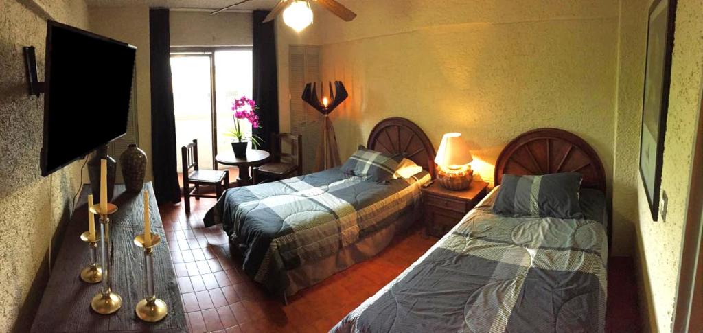 Postel nebo postele na pokoji v ubytování Aurora Suites