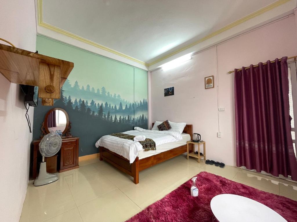 Postel nebo postele na pokoji v ubytování NiNi Homestay Sapa