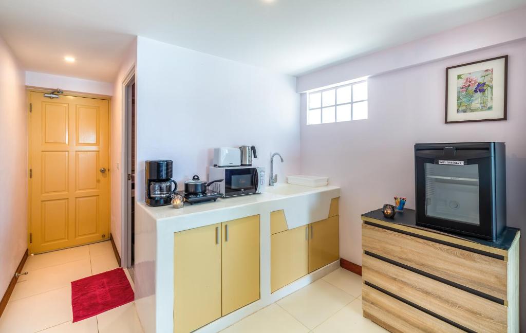 Kuchyň nebo kuchyňský kout v ubytování Mango Tree Villa