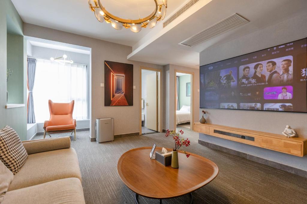 Yise Serviced Apartment -Beijing CCTV Shop tesisinde bir televizyon ve/veya eğlence merkezi