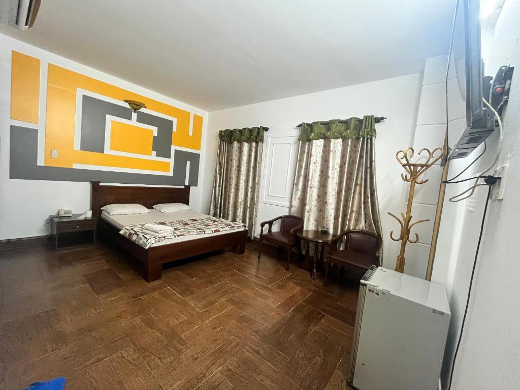 Ένα ή περισσότερα κρεβάτια σε δωμάτιο στο Nhật Vân 2