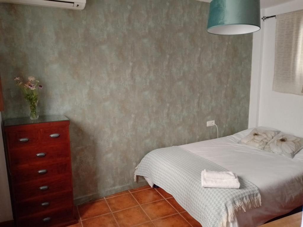 A bed or beds in a room at Claustro Home Casco Histórico Córdoba