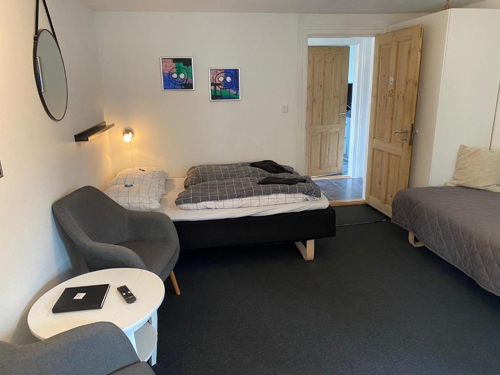 En eller flere senger på et rom på Siesta Vejle