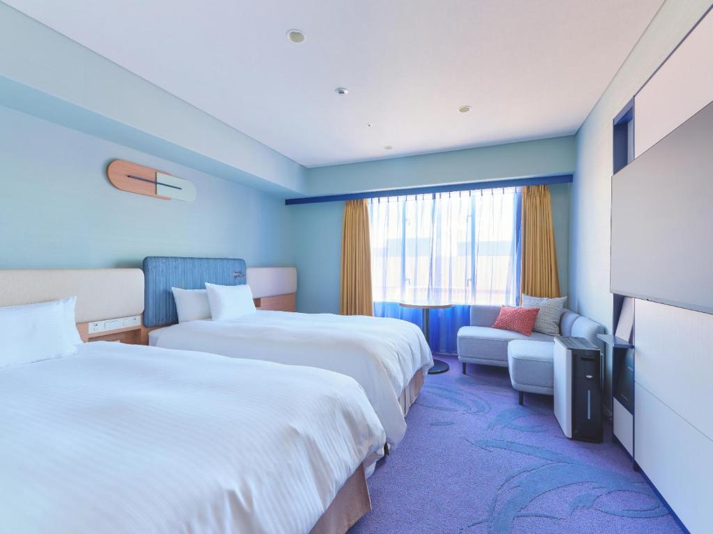 Postel nebo postele na pokoji v ubytování Miyako Hotel Kyoto Hachijo