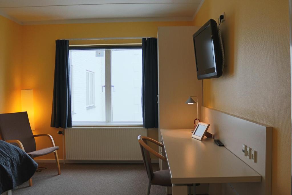 TV a/nebo společenská místnost v ubytování Milling Hotel Søpark