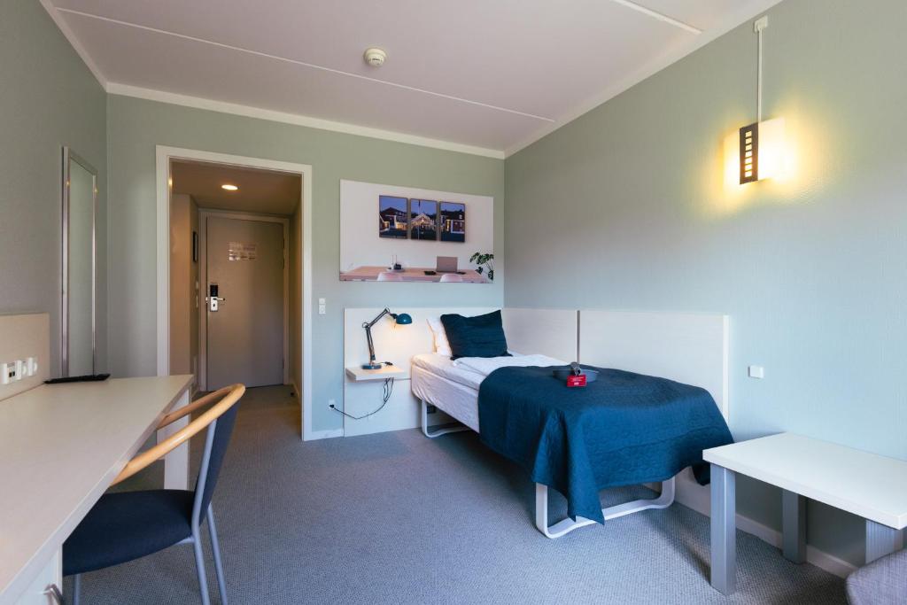 Postel nebo postele na pokoji v ubytování Milling Hotel Søpark
