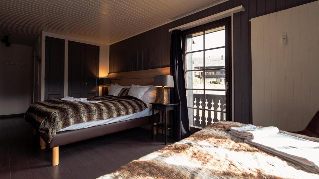 Voodi või voodid majutusasutuse Champoussin Lodge toas