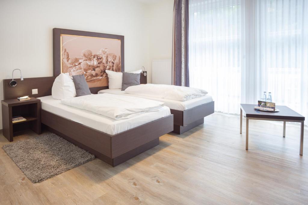 Postel nebo postele na pokoji v ubytování Hotel & Restaurant Schaumburger Ritter, Rinteln