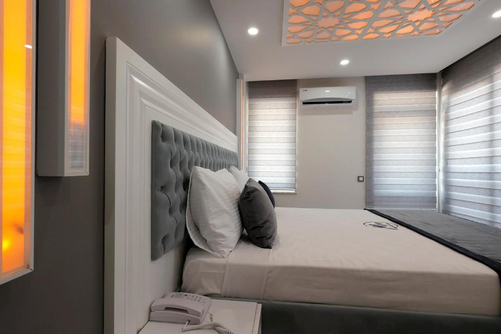 Postel nebo postele na pokoji v ubytování Mira Hotel Antalya