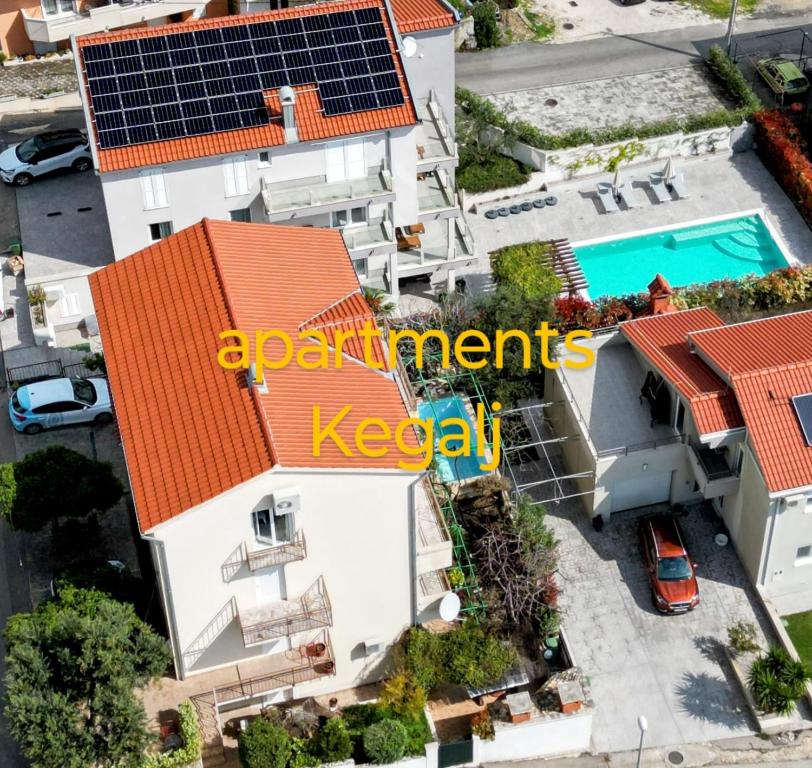 an overhead view of a house with solar panels on its roof at Apartments Kegalj in Podstrana