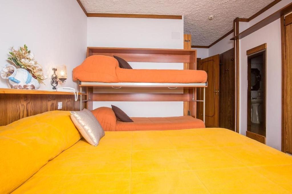 Postel nebo postele na pokoji v ubytování Hotel Tre Cime Terminillo
