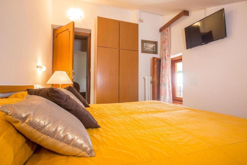 Postel nebo postele na pokoji v ubytování Hotel Tre Cime Terminillo