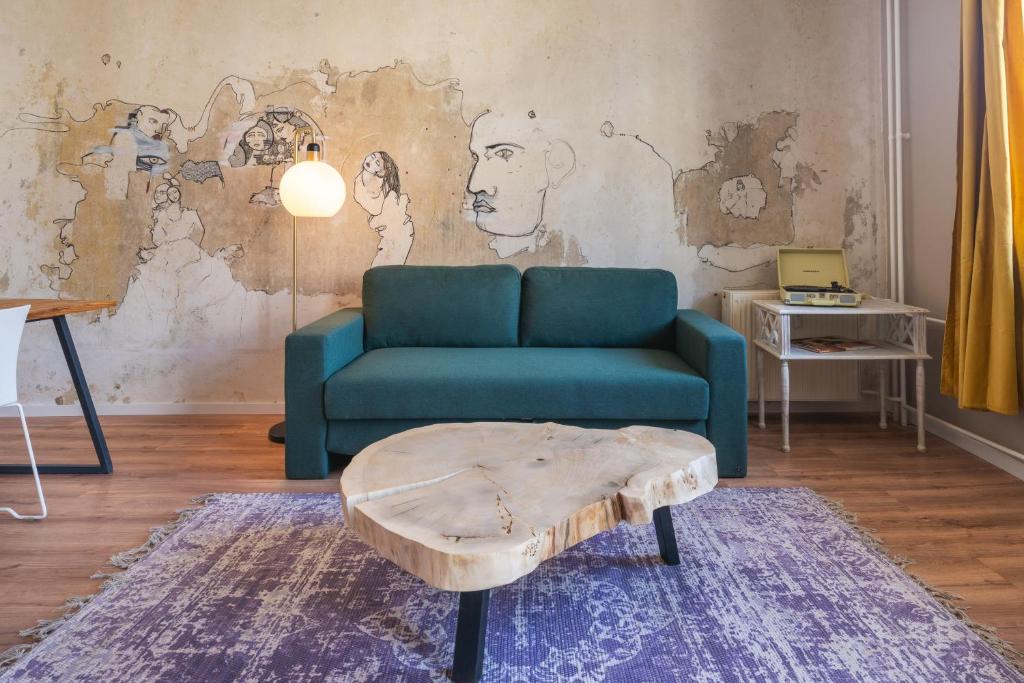 a living room with a couch and a coffee table at Design Apartments - "Am Schloss" in Potsdam
