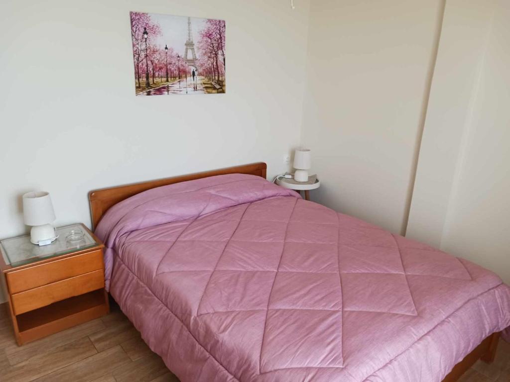 Postel nebo postele na pokoji v ubytování FIORE ROOMS
