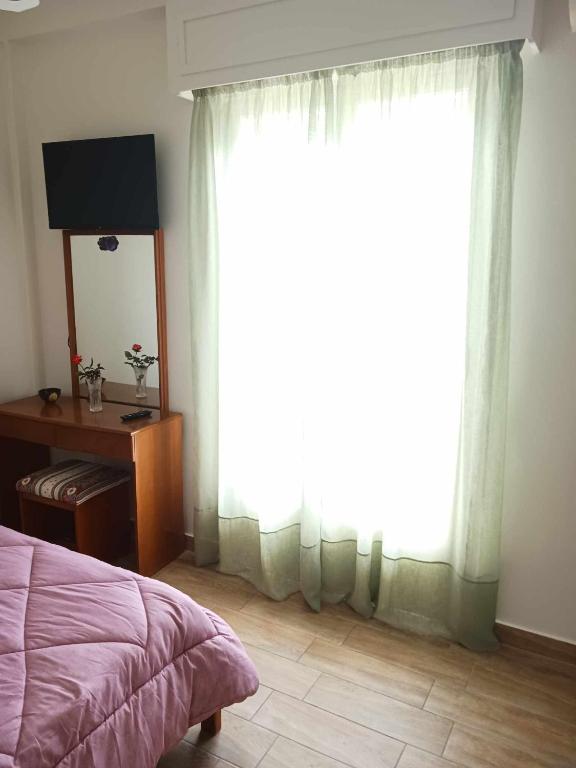 TV a/nebo společenská místnost v ubytování FIORE ROOMS