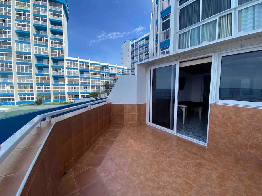a balcony with a view of a building at Apartment with sea view! Mesa del Mar 120 in Santa Cruz de Tenerife
