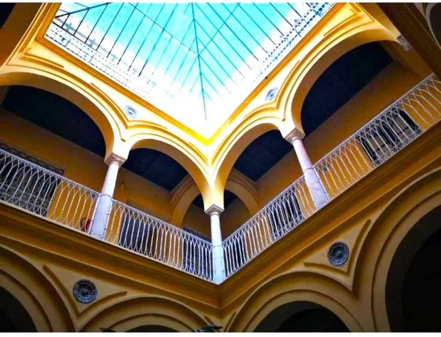 a ceiling with a skylight in a building at Conteros Centro Apartment in Seville