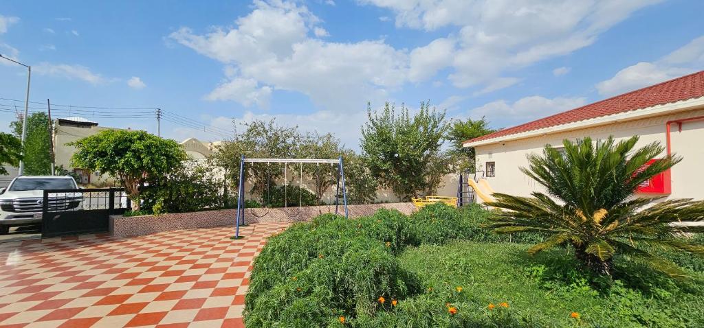 a soccer goal in the middle of a yard at شذا المصيف لبيوت العطلات in Al Shafa