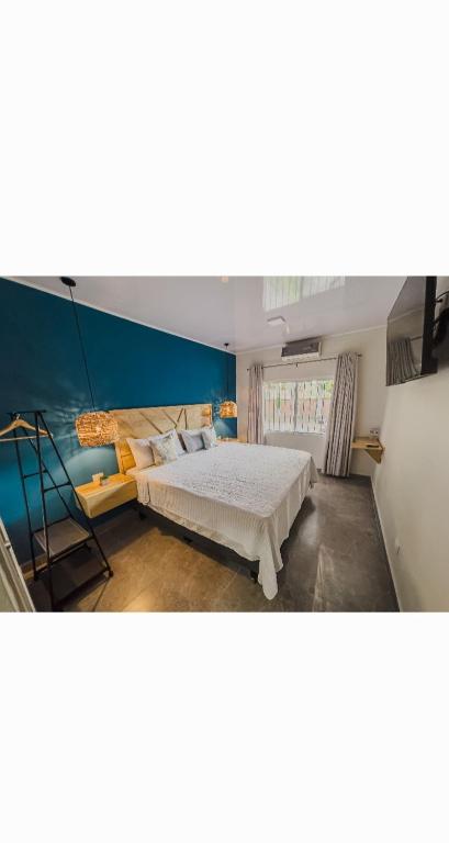 Postel nebo postele na pokoji v ubytování WE Hotel, La Lima