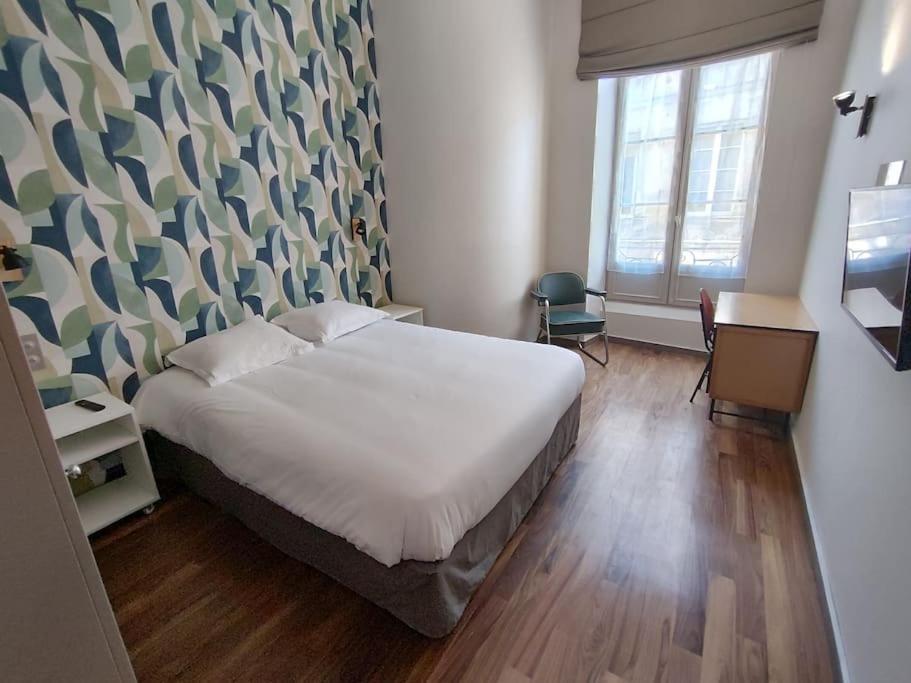 Ένα ή περισσότερα κρεβάτια σε δωμάτιο στο Appartement quartier Chartrons étage 1