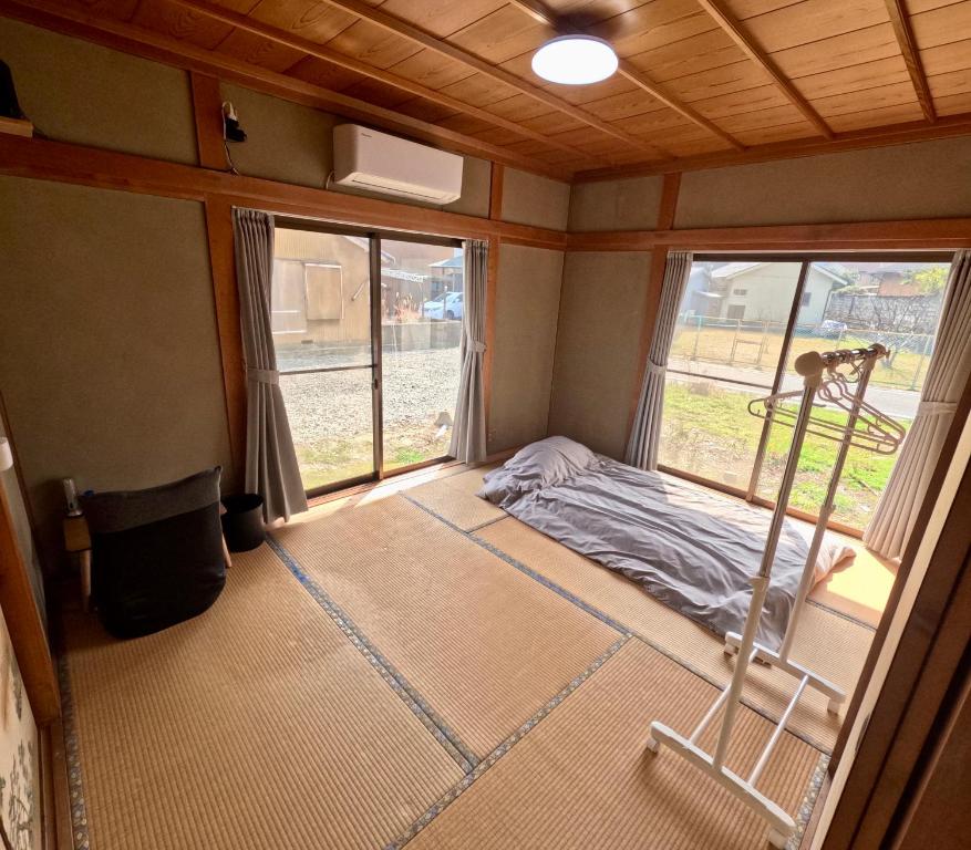 Postel nebo postele na pokoji v ubytování Guesthouse NAMAZU