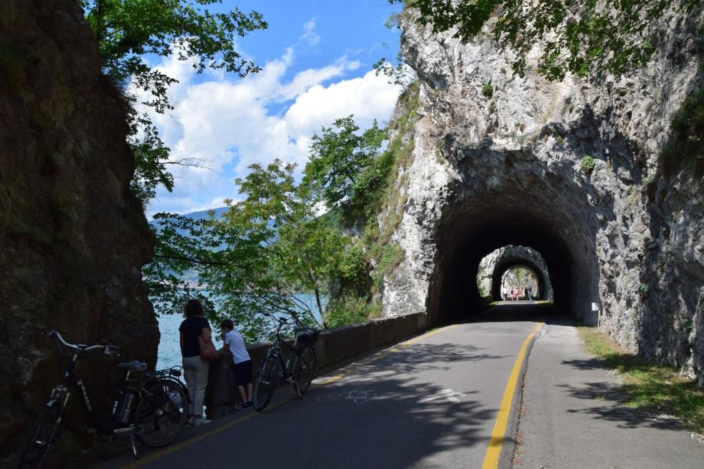 a group of people standing in front of a tunnel at Angelo&Marì Mountain Lake Iseo Hospitality in Marone