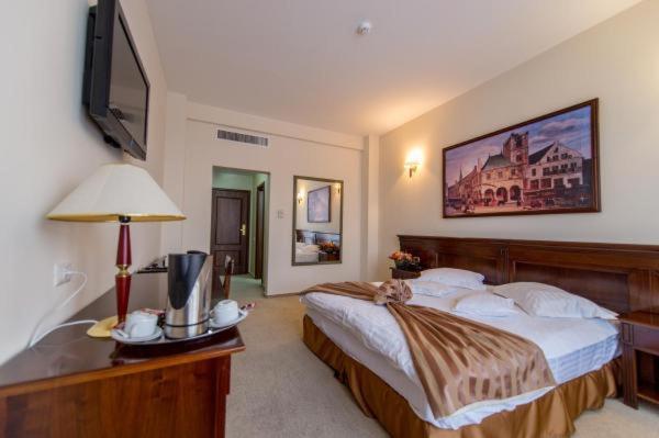 Postel nebo postele na pokoji v ubytování Hotel Rexton