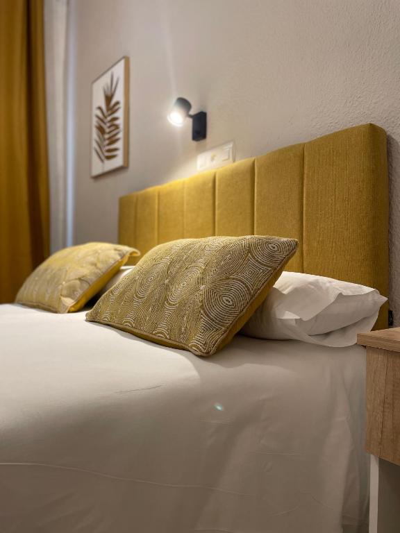 Postel nebo postele na pokoji v ubytování Sueños de Lorca Guest House