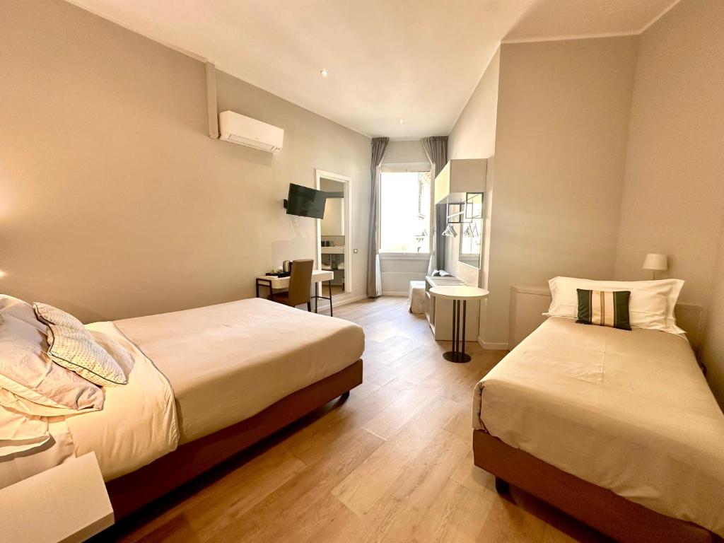 Postel nebo postele na pokoji v ubytování Hotel Giappone