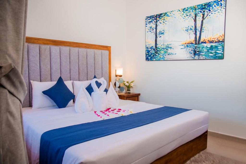 Postel nebo postele na pokoji v ubytování Golden Shower Inn