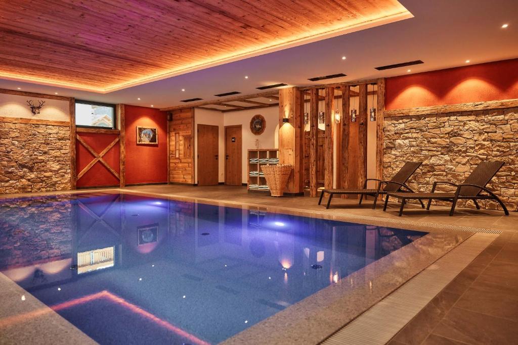 a swimming pool in a house at Hotel Olympia in Sarntal