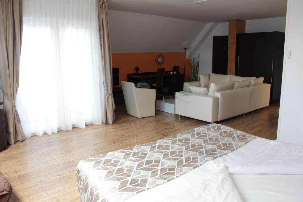 Postel nebo postele na pokoji v ubytování Threeland Hotel