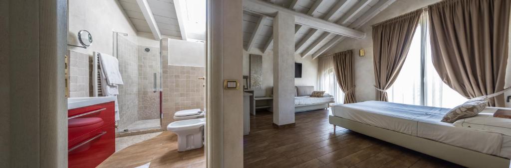 Postel nebo postele na pokoji v ubytování Agriturismo La Camilla