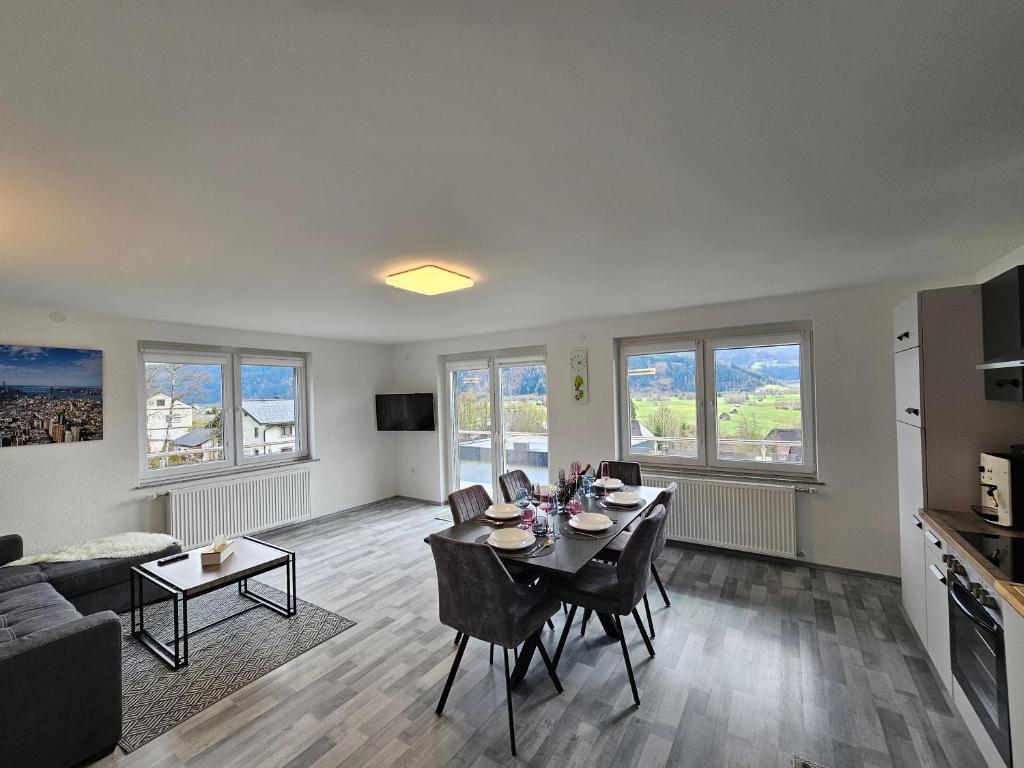a living room with a table and chairs and a couch at Appartment Jasmin in Liezen