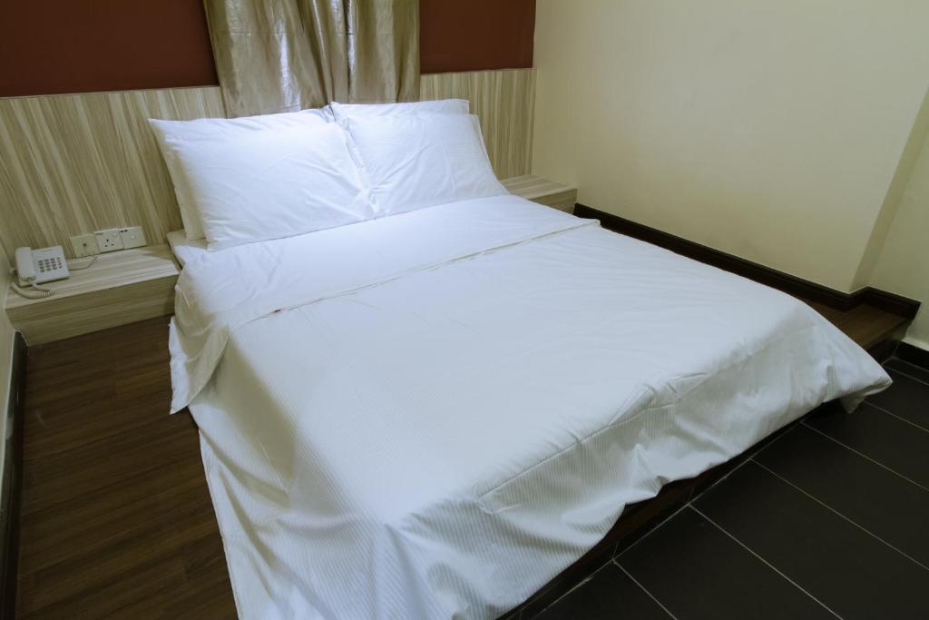 Postel nebo postele na pokoji v ubytování JS Hotel