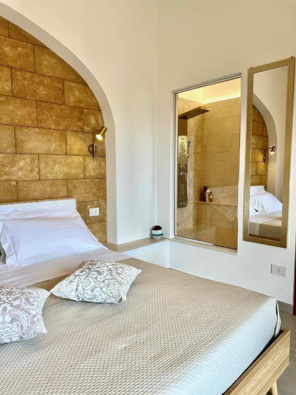 Postel nebo postele na pokoji v ubytování Terrazza Levante - Boutique rooms