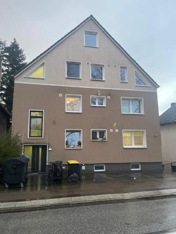 a large house with many windows on the side of it at InselSuites FinkenNest Airbus Finkenkwerder 125 m2 Kamin Whirpool in Hamburg