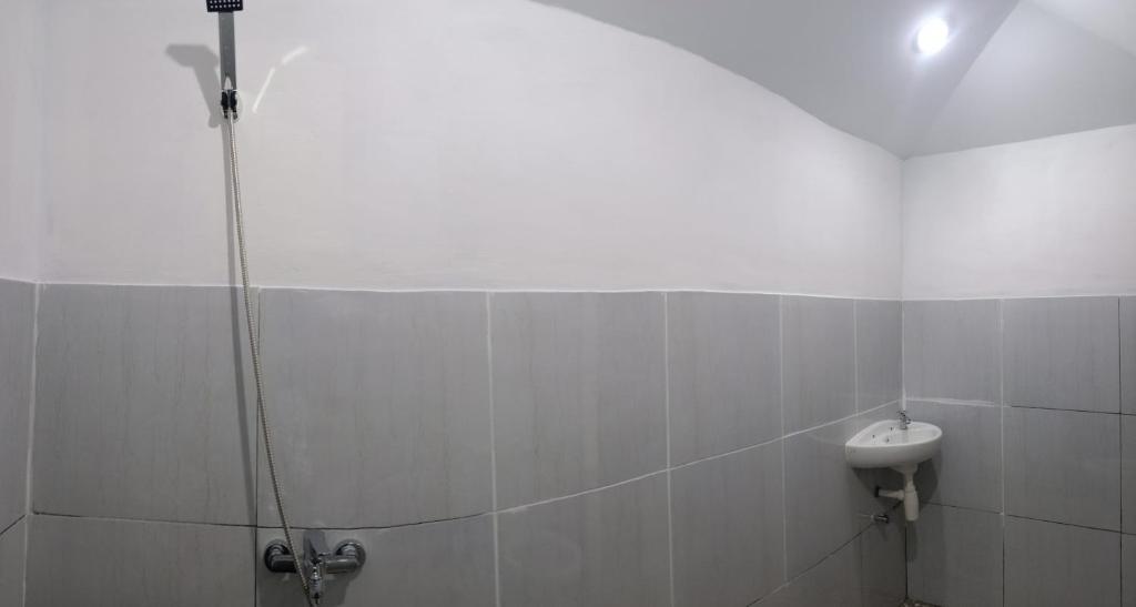 Koupelna v ubytování Bayan Exotic Homestay