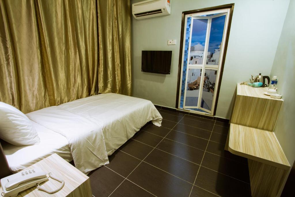 TV a/nebo společenská místnost v ubytování JS Hotel