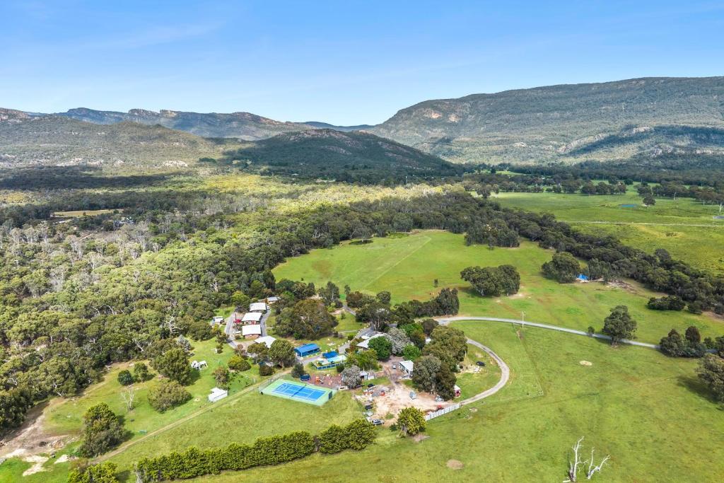 an aerial view of an estate with mountains in the background at Halls Haven Tiny House 2 in Halls Gap